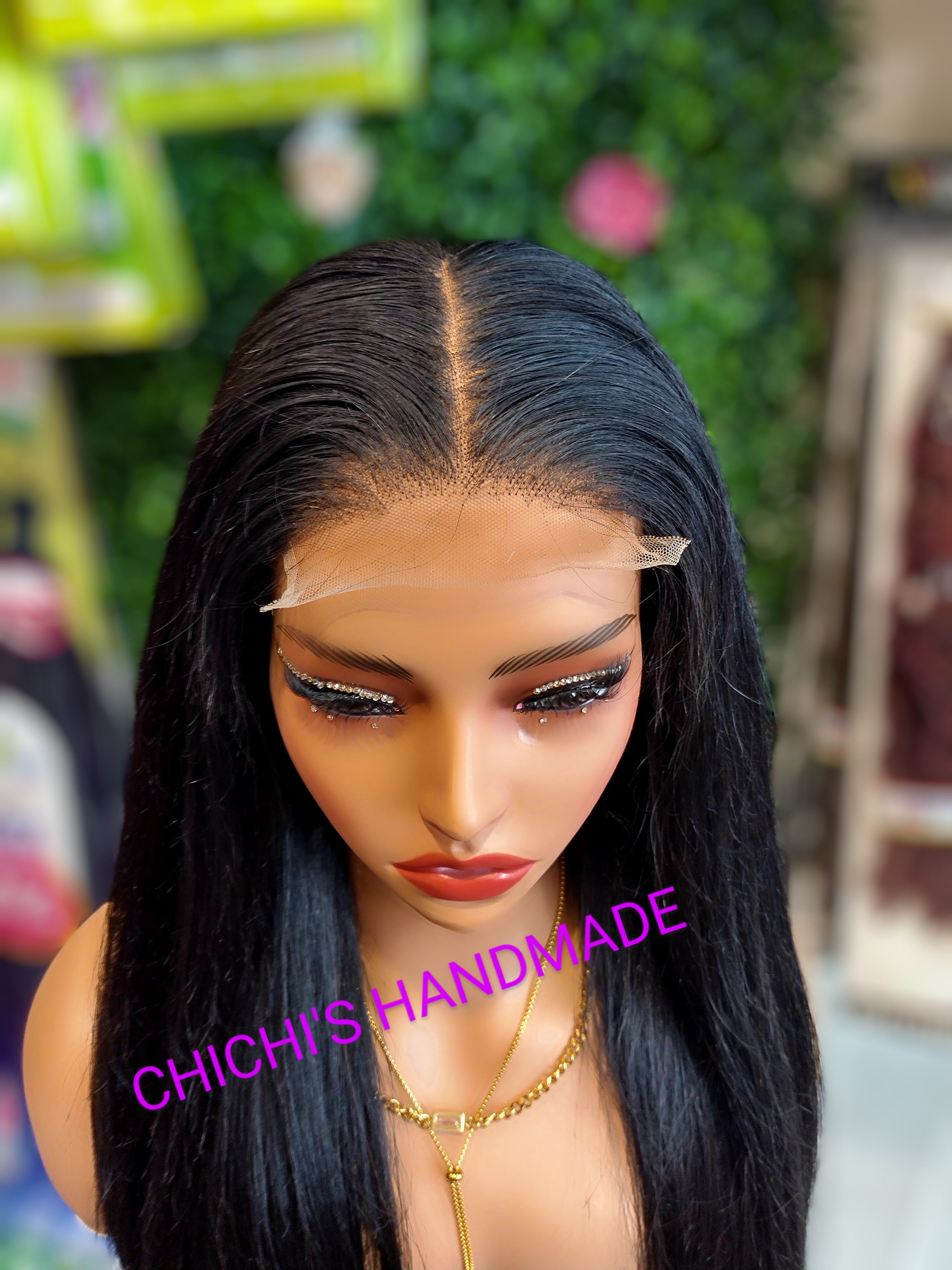 Person with a black wig, with 'Chichi's Handmade' branding visible.